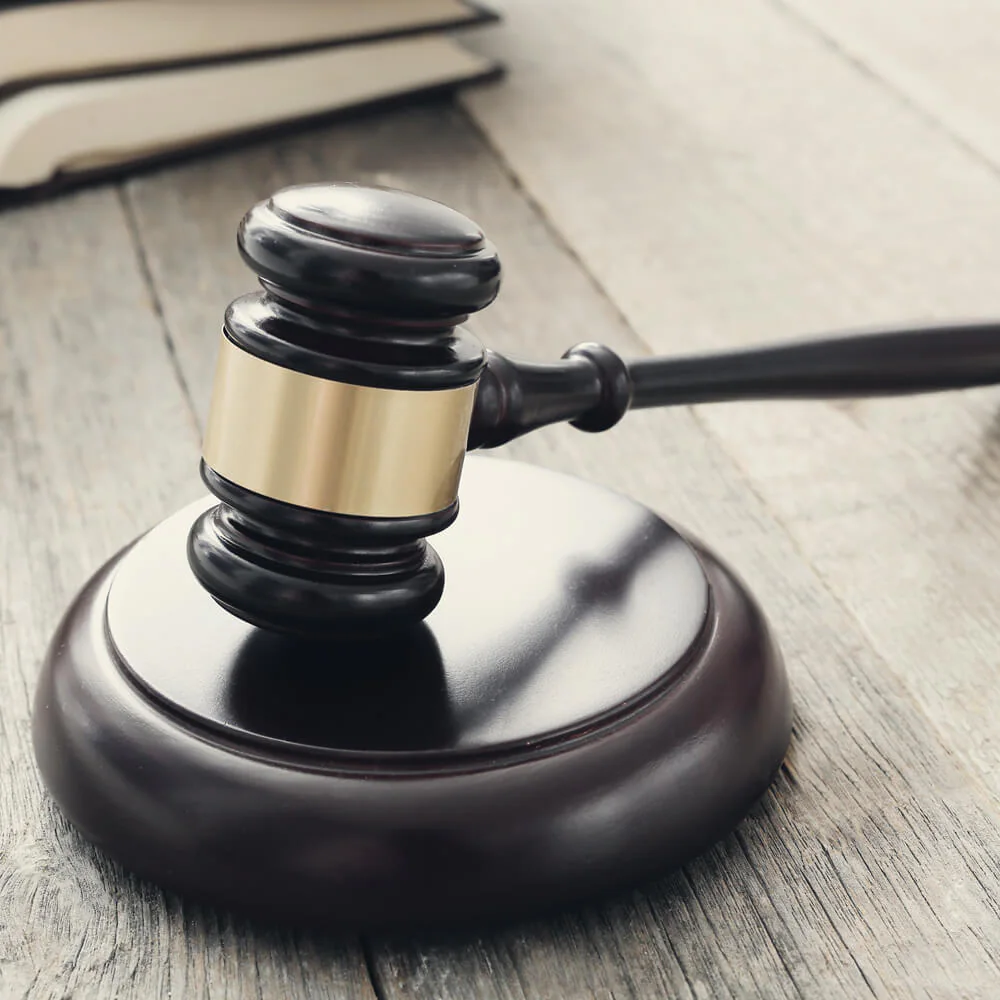 A gavel resting on a desk