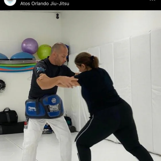 A volunteer instructor leading a self-defence class